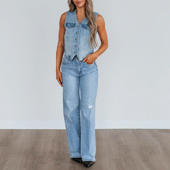 Women's denim vest with button placket and modern cut details. 3